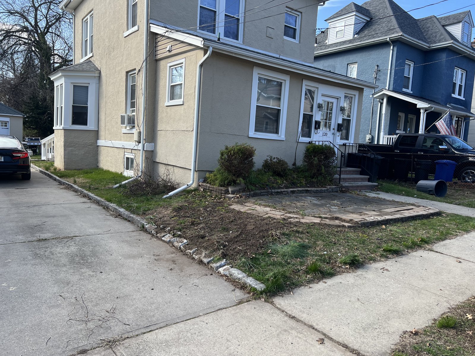 Front yard cleared of the old plantings — exposed the existing stone so I could see what I was working with.