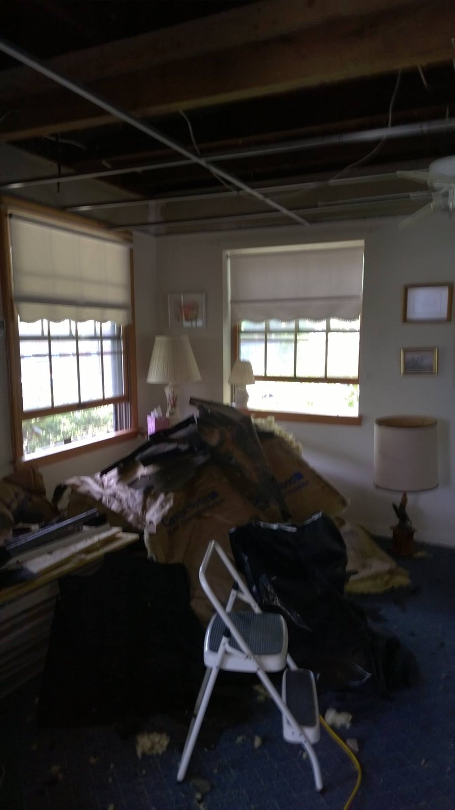 Pulled the ceiling drywall in the bedroom first so I could see joists and wiring before touching the walls.