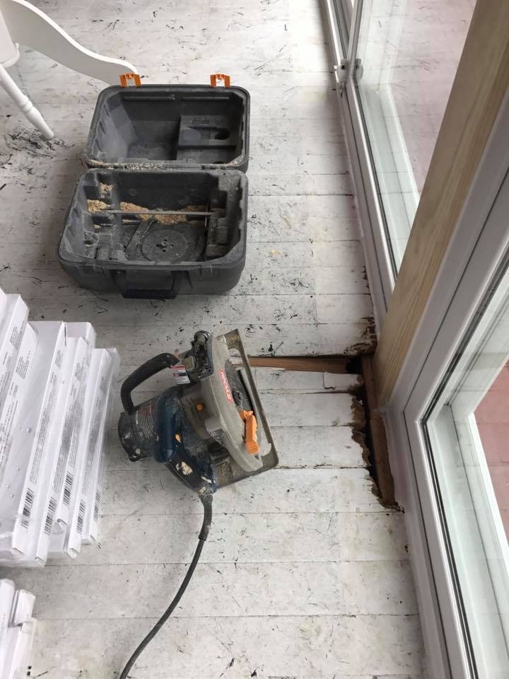 Saw and toolbox staged near the slider before laying floor.