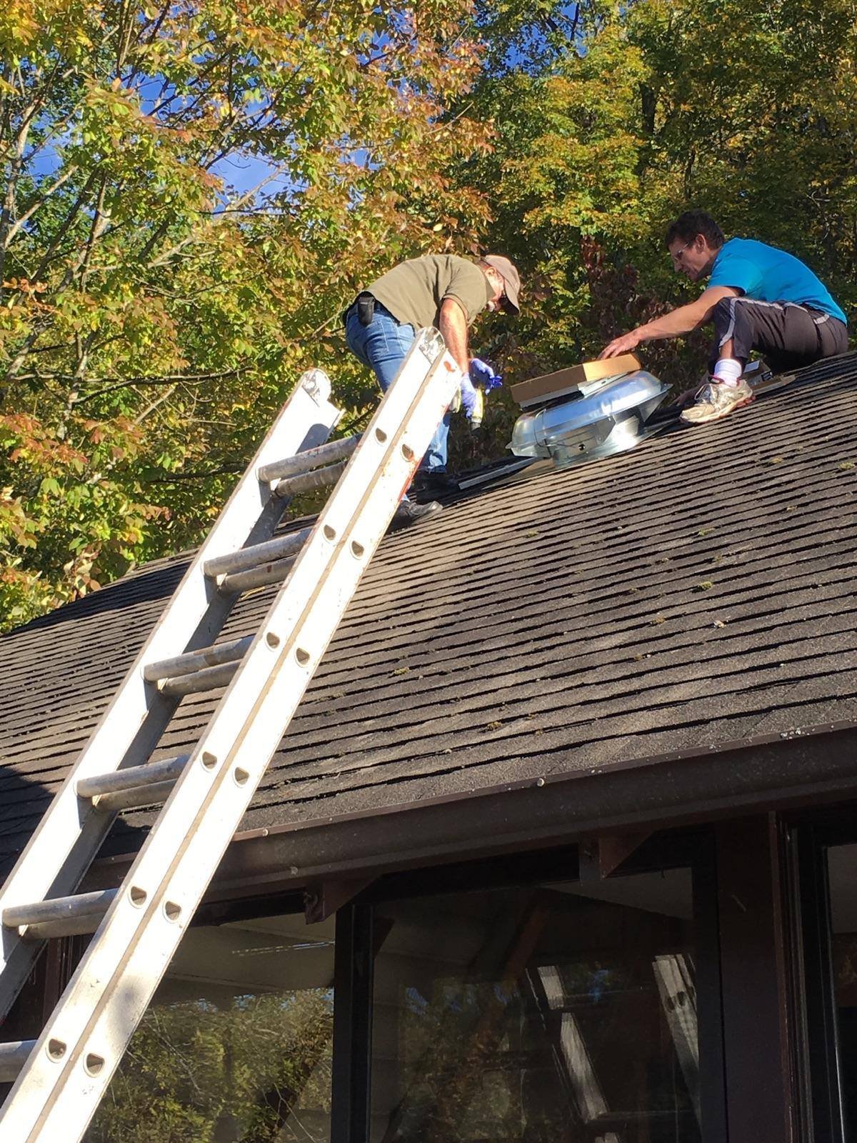Cutting in the powered attic vent through the shingles. Picked a fall day so the roof wasn't roasting.