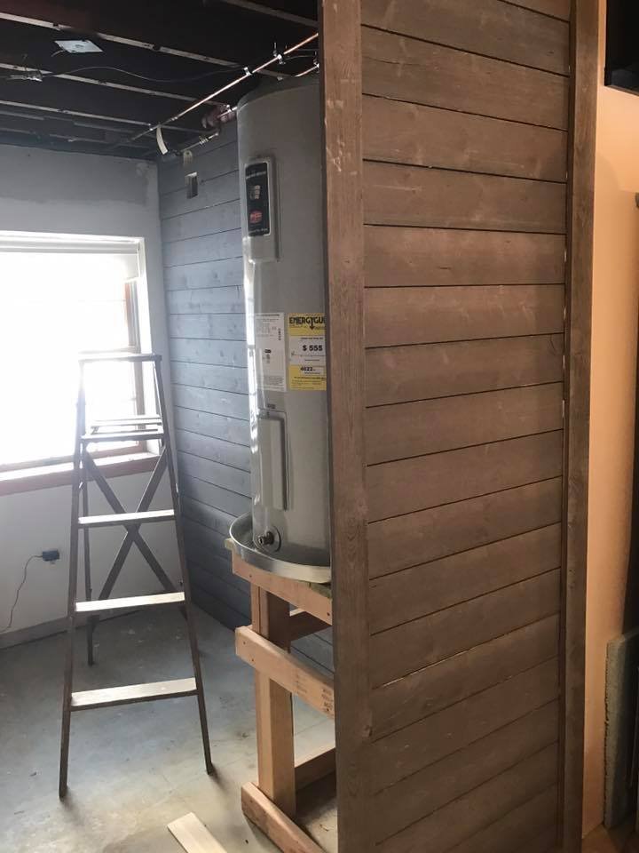 Set the new electric water heater on a wood platform — gets it off the slab in case anything ever leaks.