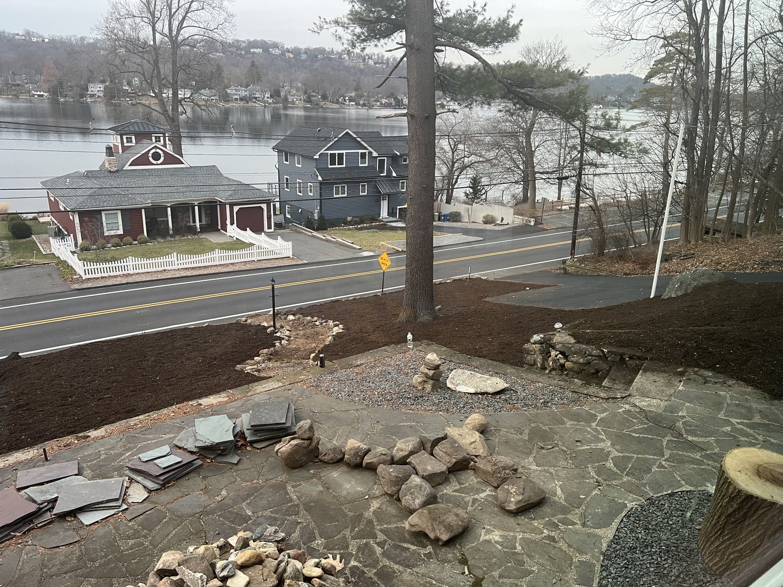 Beds mulched, stones placed, slate staged for the last piece of patio repair.
