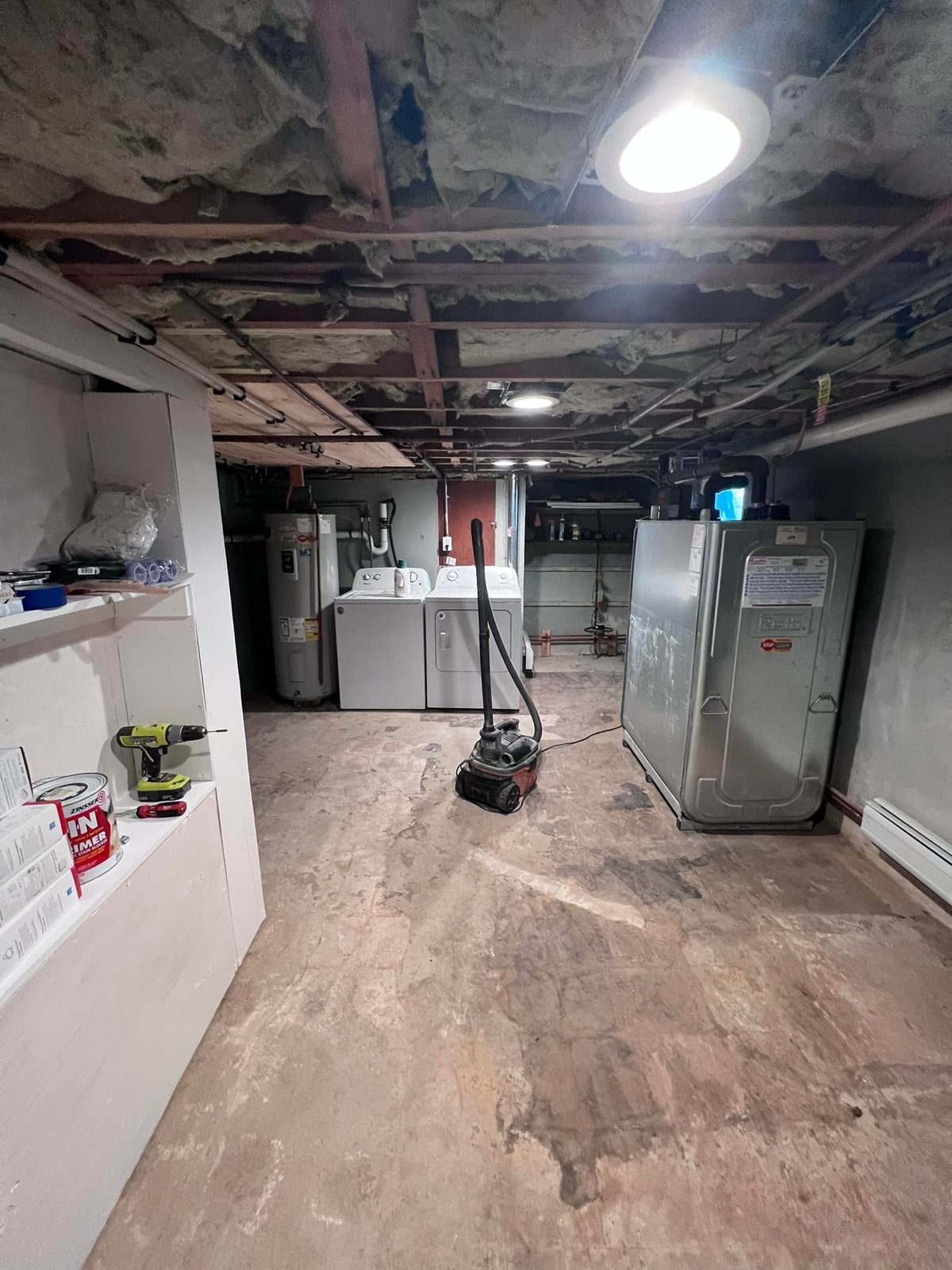 Started here. Bare slab, exposed joists, utilities all on display.