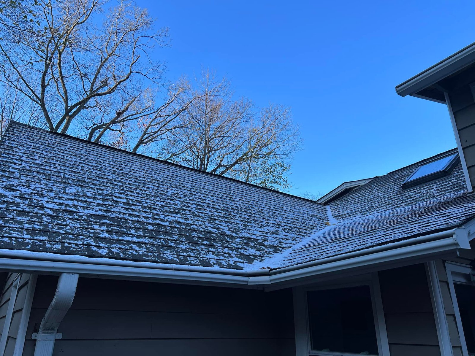 Roof before — frost on the old shingles. The valley is where the new vent cap had to land.