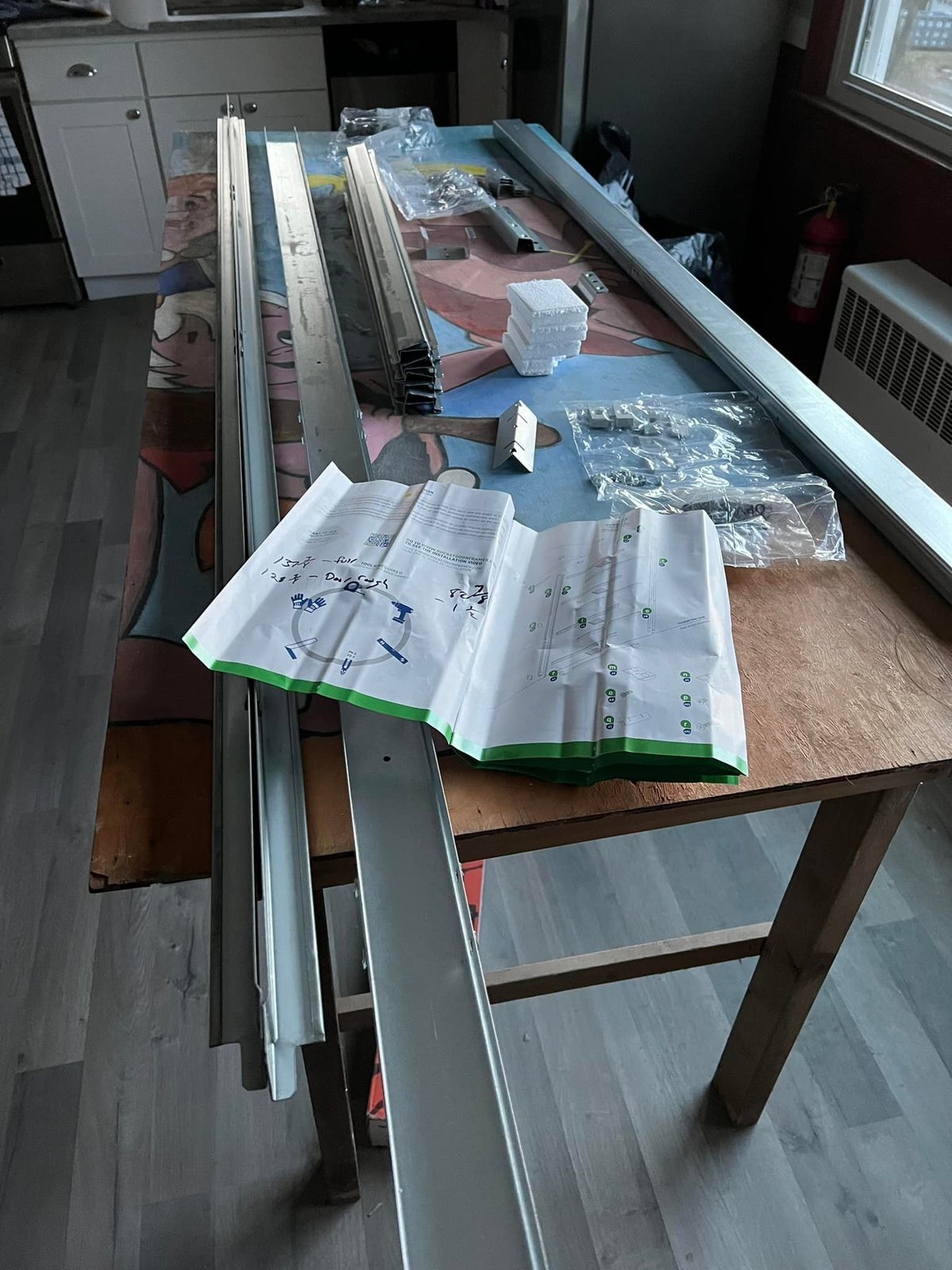 Track hardware and instructions out on the bench before I started cutting.