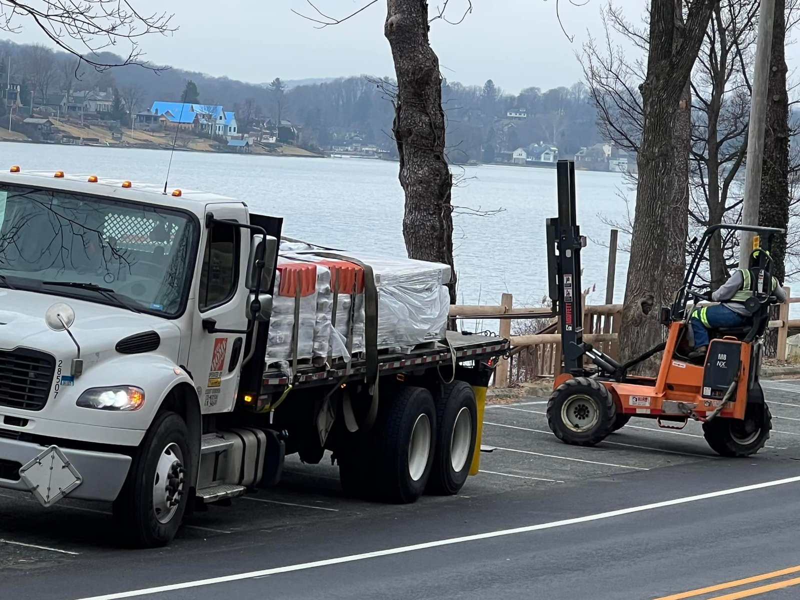 Home Depot flatbed dropped the pallet at the lake side. Piggyback forklift earned its keep that day.