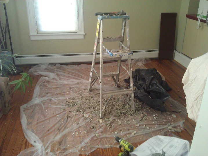 Pulled down the failing ceiling section onto a drop cloth so I could sister in fresh drywall above.